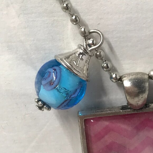 NEW Pendent necklace with pink pendent and 2 charms.  Comes on a 22 inch chain - Picture 3 of 6